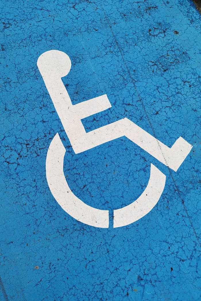 Mastering the First Impression: Your intriguing post title goes here Parking space with wheelchair symbol on blue background for accessibility.